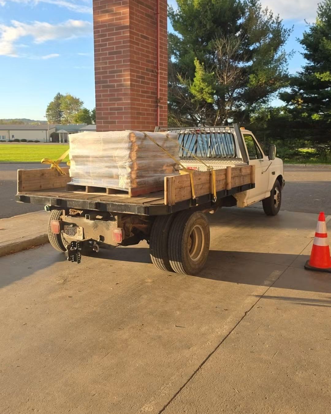 Pallet of concrete strapped down on the flatbed